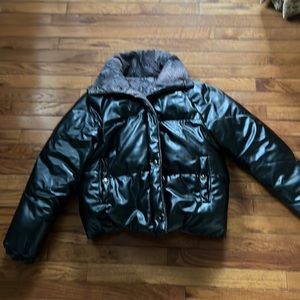Black puffer jacket. Inside is brown/black snakeskin print. Can be reversible.